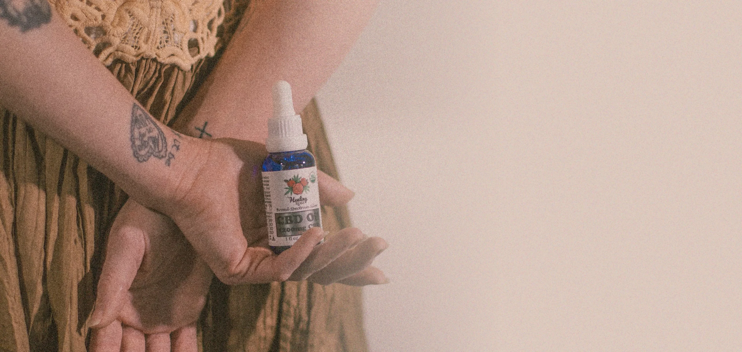 Organic 1200mg CBD Oil (Broad Spectrum) being held by model